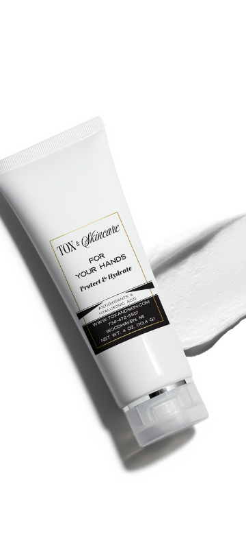 TOX Skincare hand cream tube with cream swatch on white background.