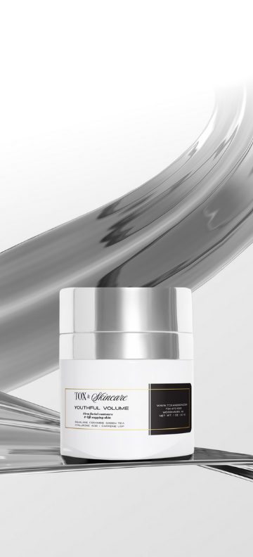 Luxury skincare product jar on a sleek metallic background.