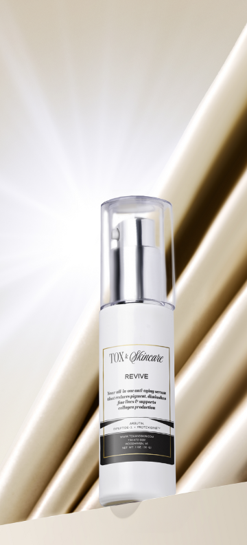 Revive anti-aging serum by Tox Skincare in a sleek bottle with light beige background.